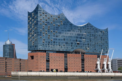 Modern buildings in city against sky