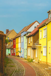 Houses against sky in city