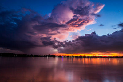 Scenic view of lake against romantic sky at sunset