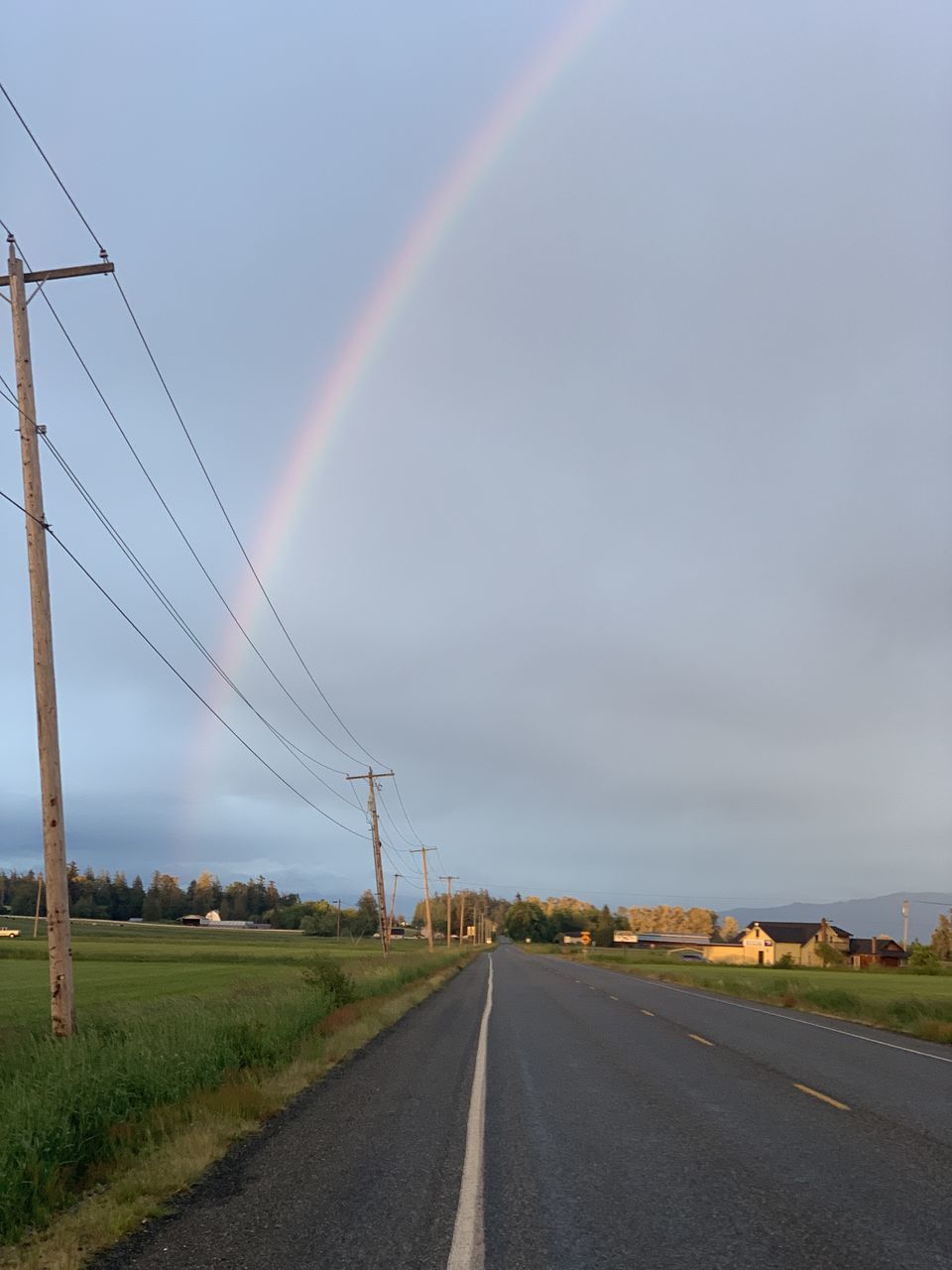 RAINBOW OVER ROAD AGAINST SKY