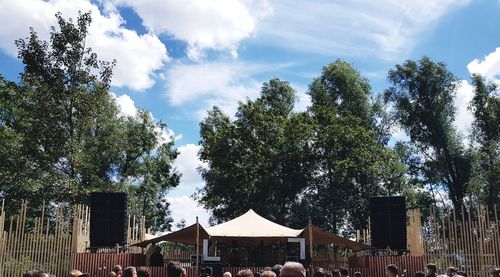 Low angle view of trees and plants in park against sky