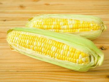 Close-up of corn on wooden table