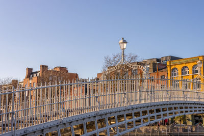 Low angle view of buildings against clear blue sky