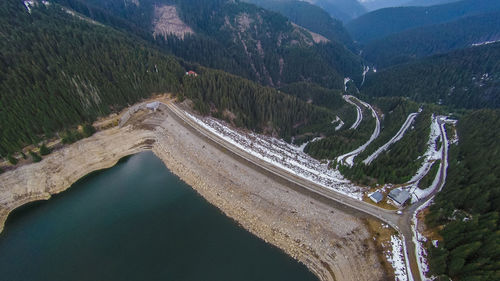 High angle view of road amidst trees and mountains