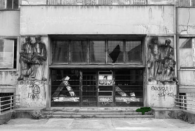Statue against building