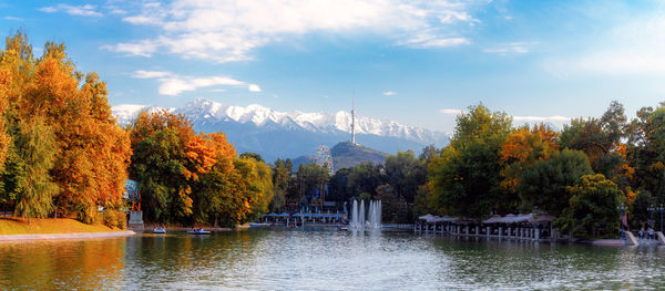 Scenic view of lake by trees against sky during autumn