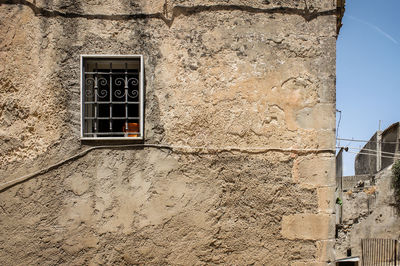 Low angle view of window on old building