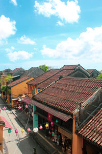 High angle view of houses against sky in city