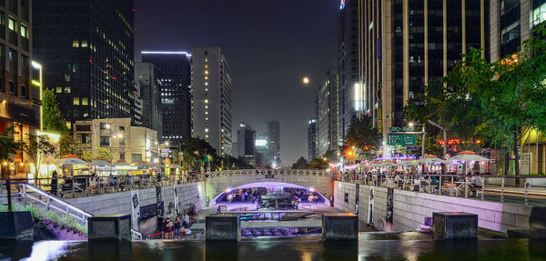 Illuminated buildings in city at night