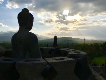 Statue against sky during sunset