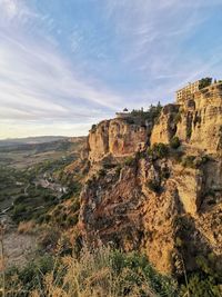 Rock formations on landscape against sky