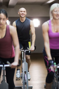 People training on exercising bikes