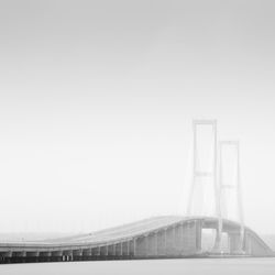 Bridge against sky in city