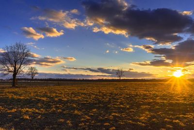 Scenic view of landscape against sky during sunset