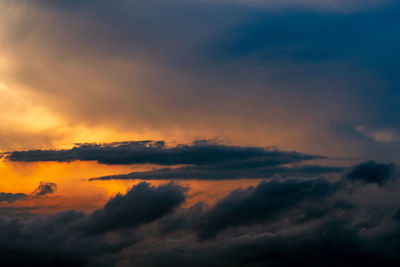 Low angle view of dramatic sky during sunset