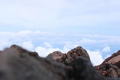 Low angle view of rock formations against sky