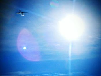 Low angle view of airplane flying in sky