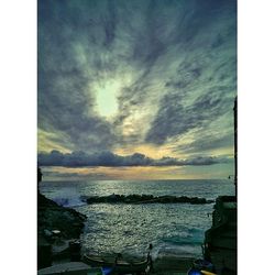 Scenic view of sea against cloudy sky