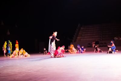 Group of people dancing at night