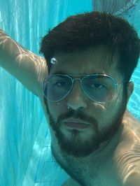 Portrait of young man in swimming pool