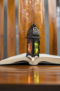 Close-up of clock on table at home