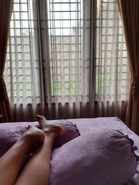 Woman relaxing on bed