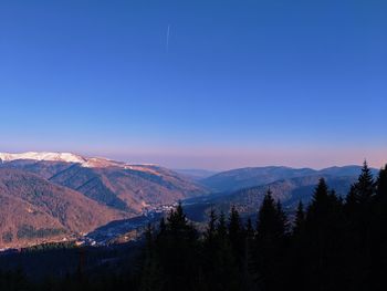 Scenic view of mountains against clear blue sky