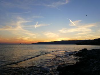 Scenic view of sea against sky at sunset