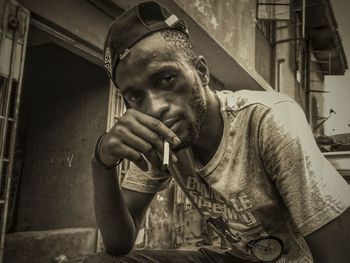 Portrait of young man looking at camera