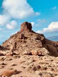 Rock formation on land against sky