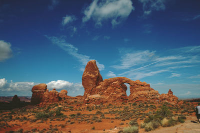 Rock formations on landscape against sky