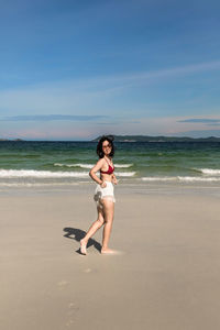 Portrait of young woman on beach