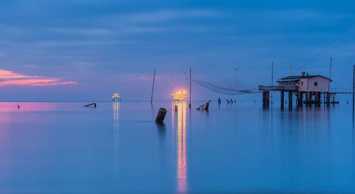 Scenic view of sea against sky at sunset