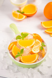 High angle view of orange fruit in plate