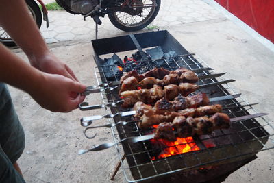 High angle view of people on barbecue grill