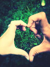 Cropped image of person standing on grassy field