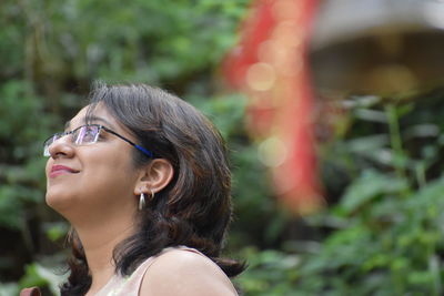 Low angle view of woman looking away