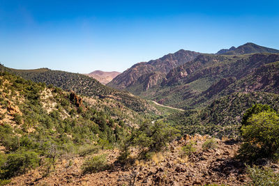 Scenic view of mountains against clear blue sky