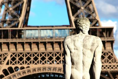 Low angle view of statue against blue sky