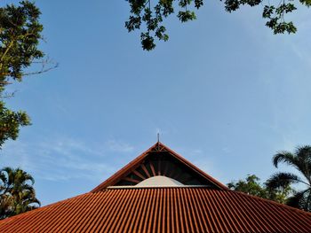 Low angle view of building against blue sky