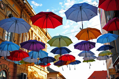 Multi colored umbrellas in city