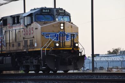 Train on railroad track against sky