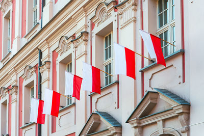 Low angle view of flags on building