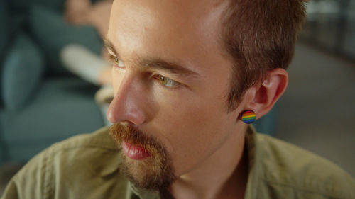 Close-up of gay man wearing earring