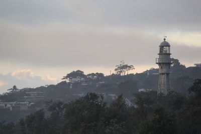 Panoramic view of trees and buildings against sky