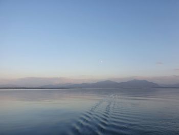 Scenic view of sea against clear sky during sunset