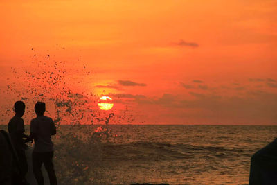 Scenic view of sea at sunset