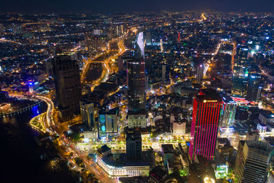 High angle view of city lit up at night