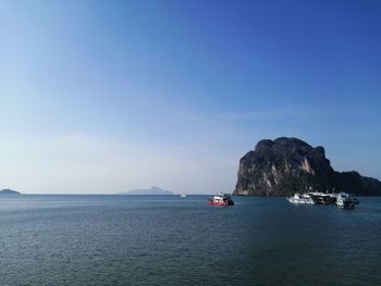 Scenic view of sea against blue sky