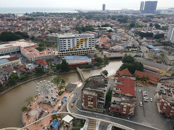 High angle view of buildings in city against sky